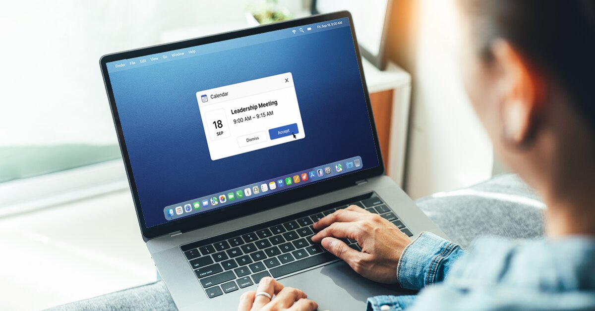 Person accepting a leadership meeting calendar invite on laptop